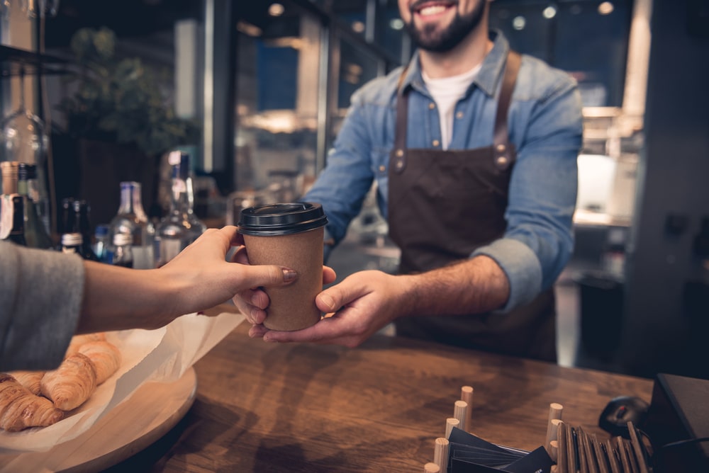 People are buying coffee while waiting for their EVs being charged.