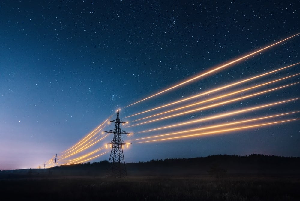 Electric grid illuminated and operational during the night.