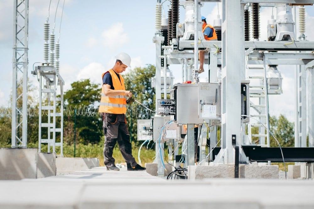 An electrical engineer working on site to establish a grid connection.