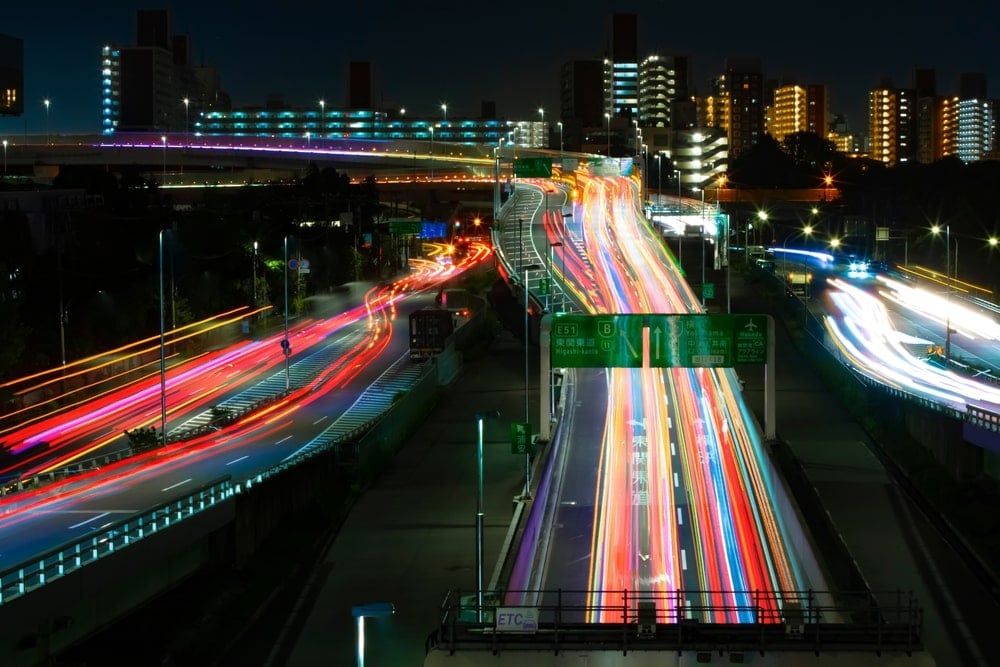 A busy intersection at night.