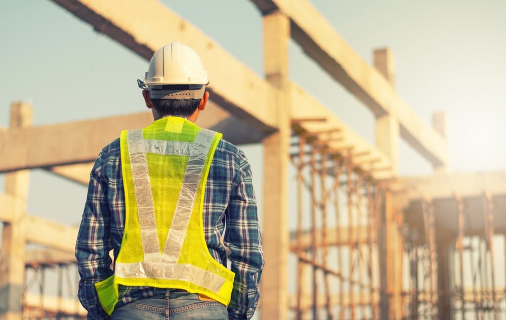 An engineer on site overlooking an installation on site.