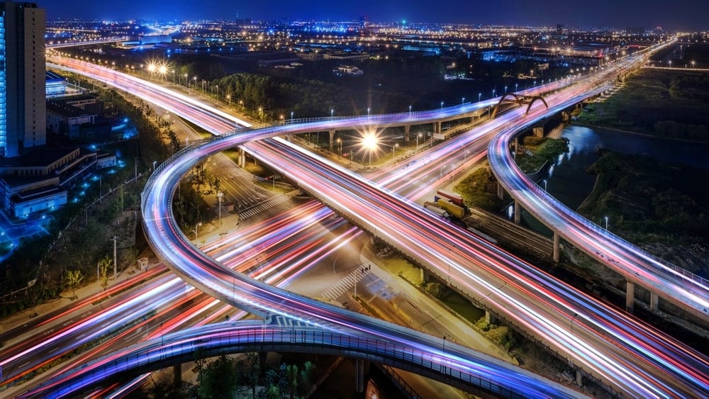 A busy intersection at night.