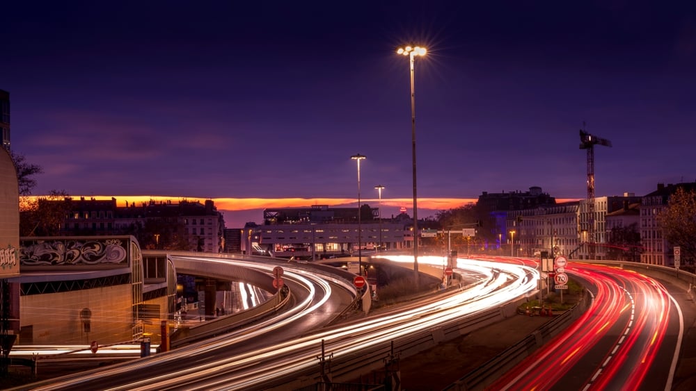 A road in Lyon, France at night.